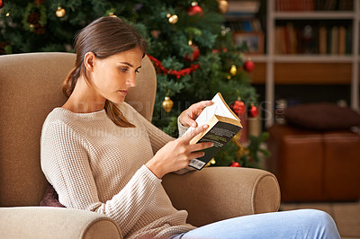 Buy stock photo Woman, reading and book on sofa at christmas in home on vacation. Comfortable, female person and fantasy novel for learning or education in living room during festive holiday with decoration