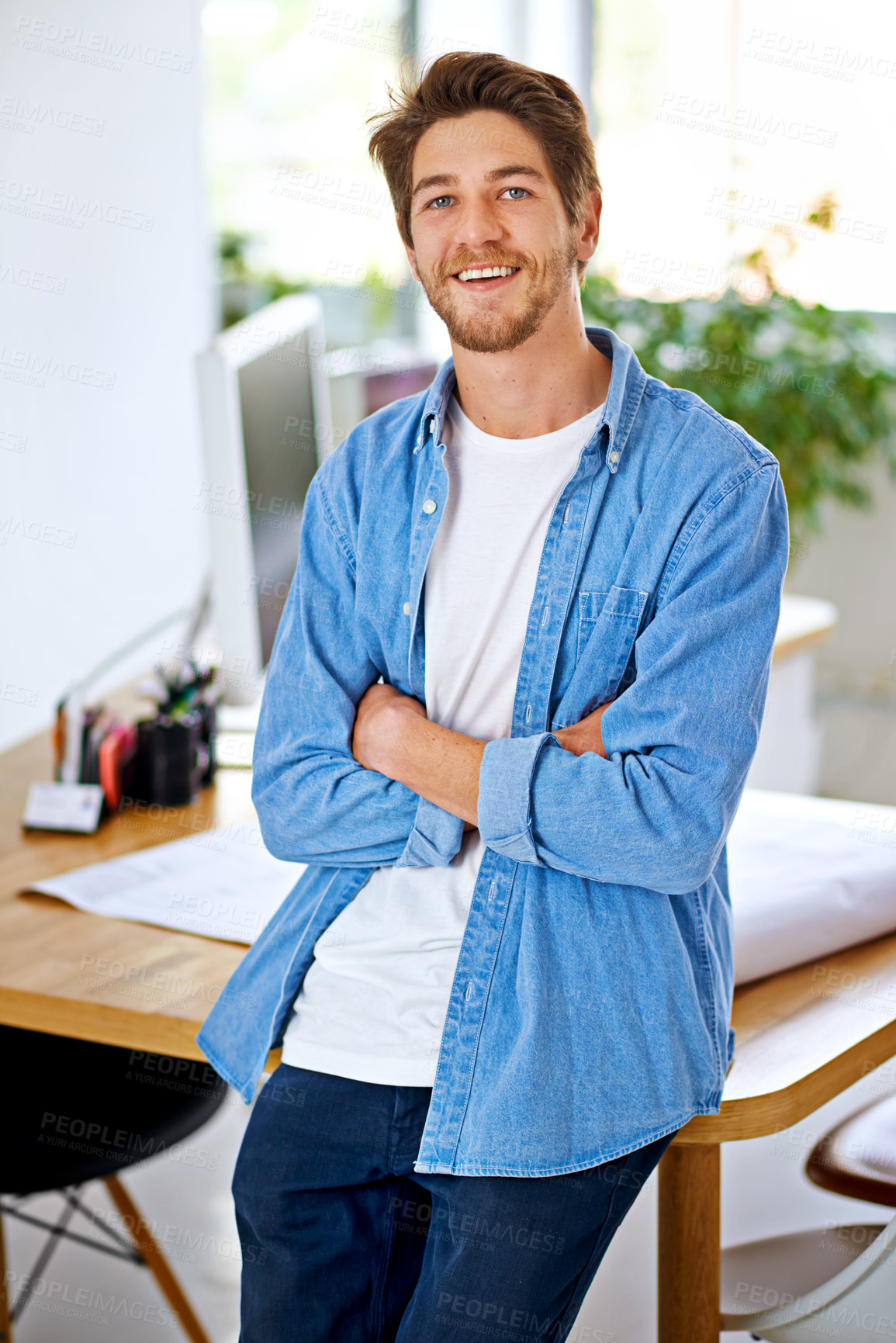 Buy stock photo Cropped shot of a handsome young designer in his office