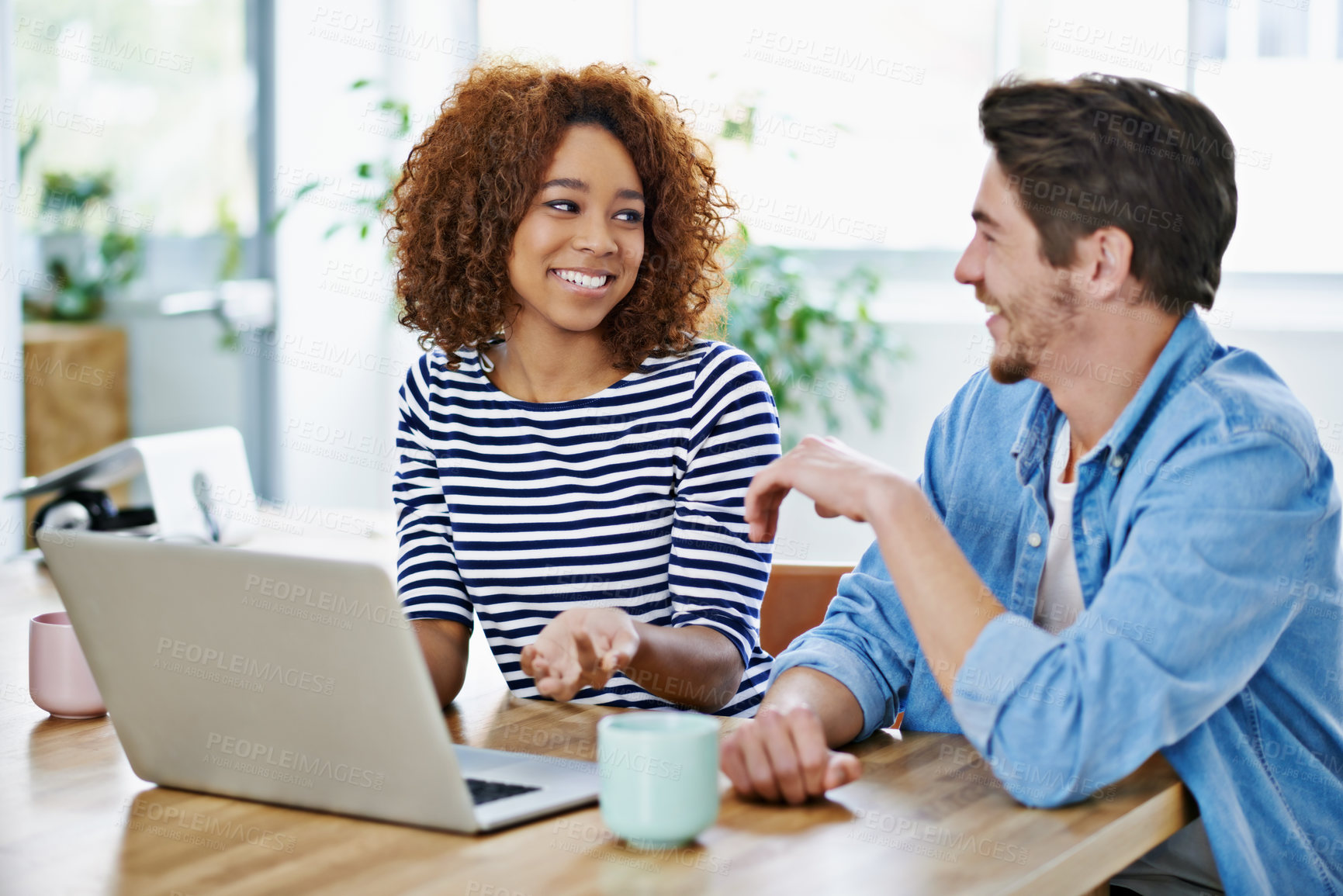 Buy stock photo Teamwork, office and talking with laptop, colleagues at desk or technology for conversation. Partnership, people or  planning, digital design career collaboration and sitting together in discussion