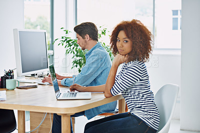Buy stock photo Portrait, African woman and coworking on laptop at desk in an office, internet and work project. Diverse people, workstation and technology screen in workplace with online, business and partnership