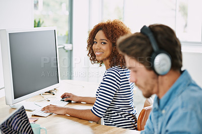 Buy stock photo Cropped shot of two colleagues working in their office