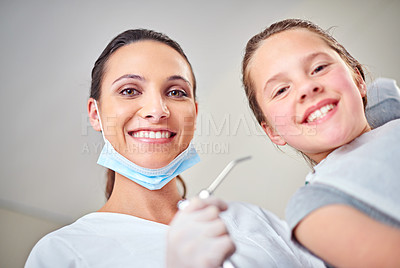 Buy stock photo Woman, portrait and dentist for oral hygiene or kid, suction and tool for treatment in consultation. Female person, confidence and orthodontist to clean teeth, specialist and patient for gum health