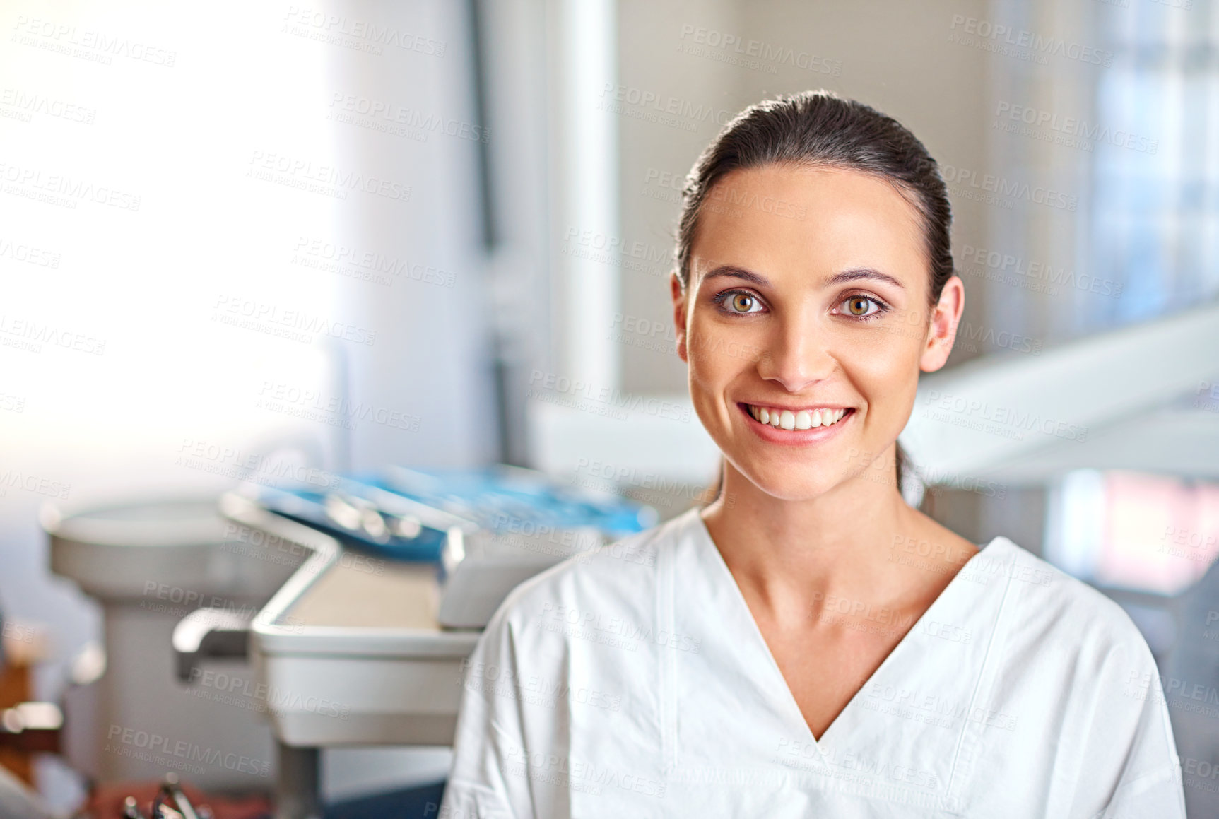 Buy stock photo Portrait of an attractive female dentist standing in her office
