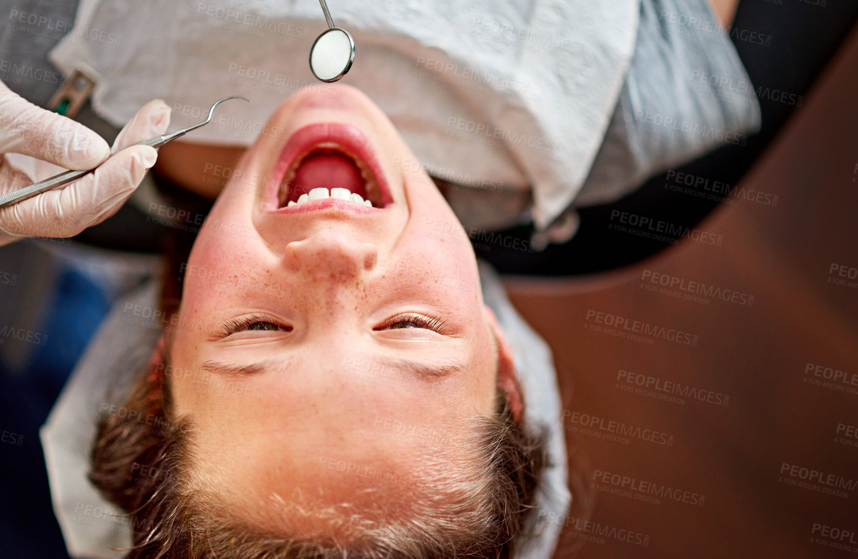 Buy stock photo Child, dentist and open mouth with tools or doctor for checkup, consulting room or oral hygiene. Boy, dental work and above with scaler for medical in clinic, expertise or treatment with equipment
