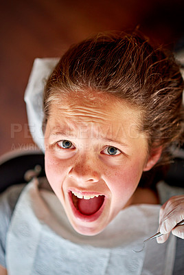 Buy stock photo Scared, child and portrait at dentist for teeth, cleaning and fear of healthcare at clinic or hospital. Dental, care and kid afraid of tools in mouth and scream for help in medical appointment