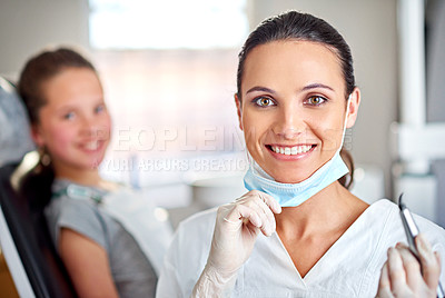 Buy stock photo Portrait of a female dentist with her child patient in the background