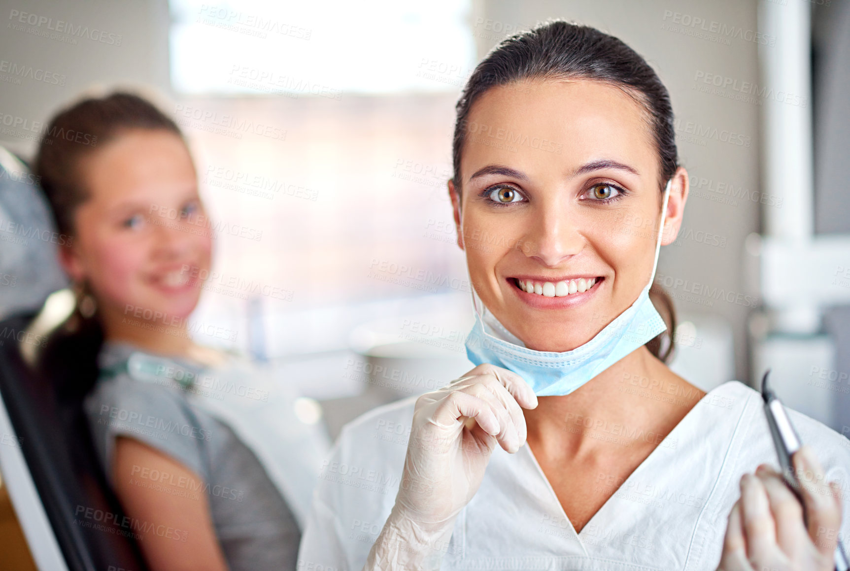 Buy stock photo Portrait of a female dentist with her child patient in the background