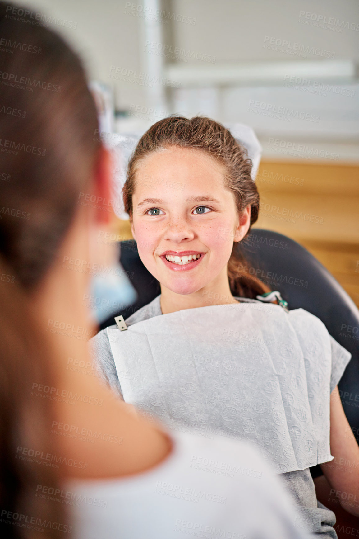 Buy stock photo Happy, child and dentist at checkup appointment in clinic office for oral hygiene and health. Female, patient and  orthodontist for braces, filling, cleaning and treatment on teeth from specialist