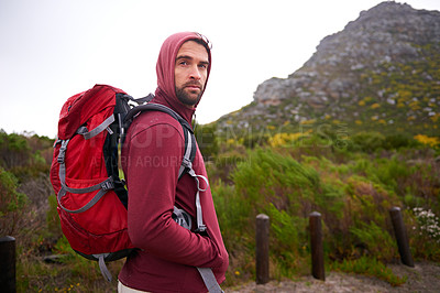 Buy stock photo Man, hiking and mountain and portrait in nature, Germany trail on wildlife conservation.  Active, male person on adventure for health and wellness, confident explorer on rocky terrain for sport