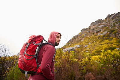Buy stock photo Hiking, trekking and man on mountain, nature and rock for outdoor adventure with backpack. Male person, athlete and sport in environment for exercise, fitness and health with plants by landscape