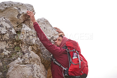 Buy stock photo Man, mountain and bouldering in nature for fitness, wellness and exercise for training and adventure in environment. Young person with backpack and rock for workout and trekking in morning with sky