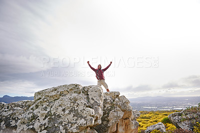 Buy stock photo Motivation, success and man with winner on mountain, nature and rock for outdoor adventure. Male person, athlete and sport in environment for exercise, fitness and health with happiness by landscape