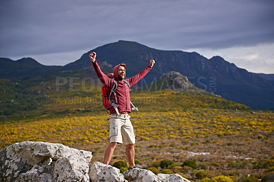 Buy stock photo Happy, mountain and man with celebration for hiking, peak and journey with success and freedom outdoor. Trekking, rock climbing and horizon with arms raised for achievement, travel and adventure