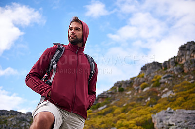 Buy stock photo Man, hiking and fitness in outdoor nature, mountain and peace or calm on rocks for wellness. Male person, exercise and travel with backpack on vacation, adventure and explore for cardio or trekking