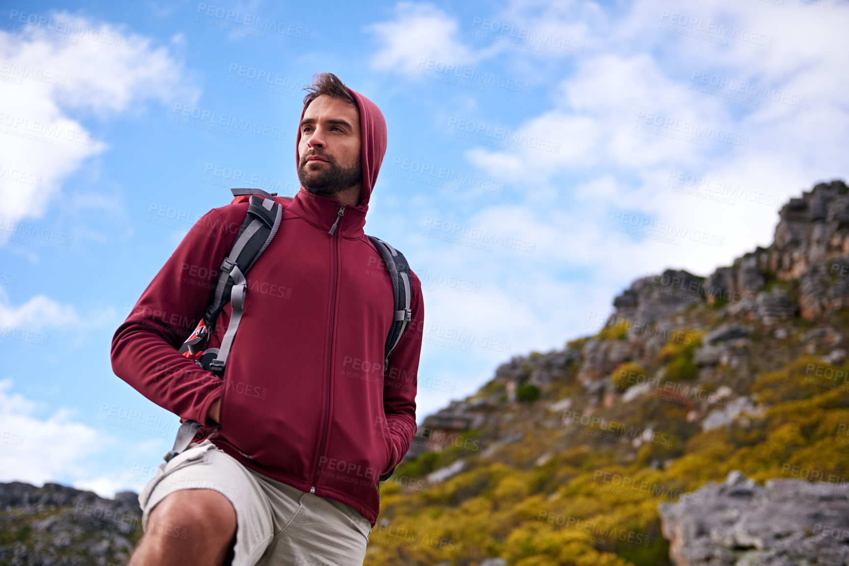 Buy stock photo Man, hiking and fitness in outdoor nature, mountain and peace or calm on rocks for wellness. Male person, exercise and travel with backpack on vacation, adventure and explore for cardio or trekking