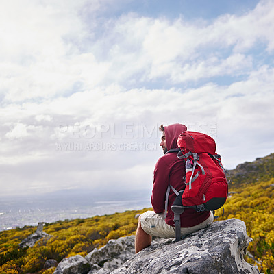 Buy stock photo Man, rock and relax on outdoor hike in nature, mountain and peace or calm in wilderness. Person, exercise and travel with backpack on vacation by cloudy sky, adventure and explore bush for fitness