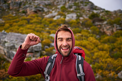 Buy stock photo Portrait, celebration and man hiking in mountain, nature and victory with fist, wellness and health. Travel, trekking and male person with smile, happiness and adventure of guy with backpack in trip
