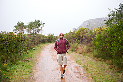 Buy stock photo Man, walking and mountain with fitness in nature, Germany trail on wildlife conservation. Active, male person on adventure for health and wellness, confident explorer on backpacking for outdoor sport