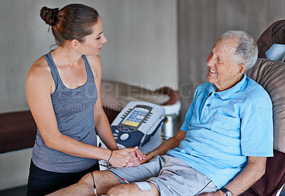 Buy stock photo Shot of an elderly man having a physiotherapy session