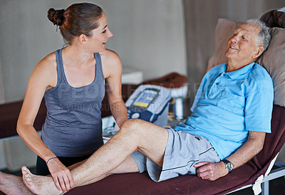Buy stock photo Shot of an elderly man having a physiotherapy session with a female therapist