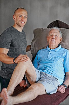 Buy stock photo Portrait of an elderly man having a physiotherapy session with a male therapist