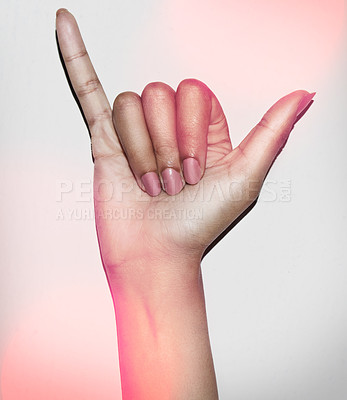 Buy stock photo Cropped shot of a hand giving the hang ten signshaka