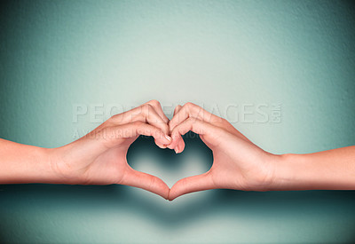 Buy stock photo Cropped shot of hands making a heart sign