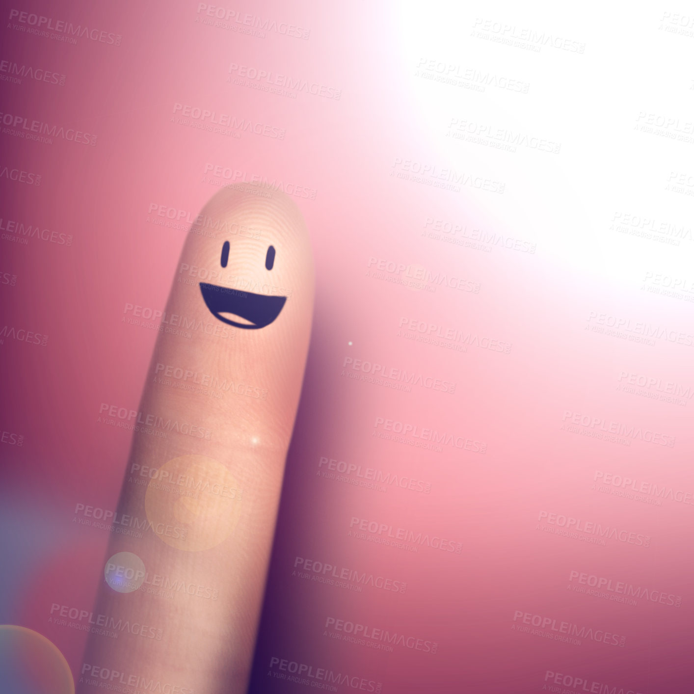 Buy stock photo Funny, face drawing and smile on finger in studio isolated on a pink background mockup space. Happy, index and creative hand gesture, sign or pointing at emoji closeup with lens flare on a backdrop