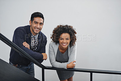Buy stock photo Employees, relax and portrait on stairs in office with happiness, pride and confidence in workplace. Business, people and smile with friends on calm break at work with staff together on railing