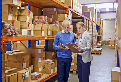 Buy stock photo Warehouse, man and woman with tablet, supply chain and inventory with cooperation and industrial. Clipboard, supervisor and management with technology and update schedule with export and cooperation