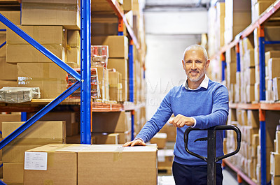 Buy stock photo Portrait of a mature man working inside in a distribution warehouse