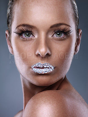 Buy stock photo Studio shot of a beautiful young woman with sparkling lips