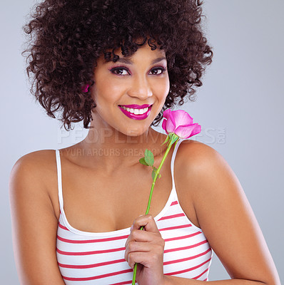 Buy stock photo Portrait, beauty and black woman with flower in studio for skincare, floral cosmetics or dermatology on gray background. Lipstick, pink rose and female model for makeup, glowing skin and eyeshadow