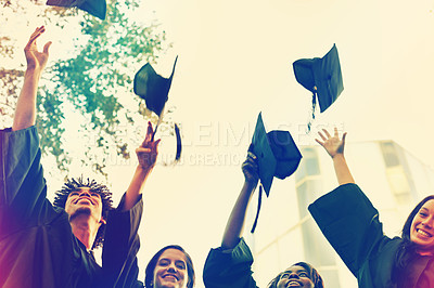 Buy stock photo Happy group, students and hats in celebration for graduation, winning or achievement at campus. People or graduates throwing caps in air for certificate, education or milestone at outdoor university