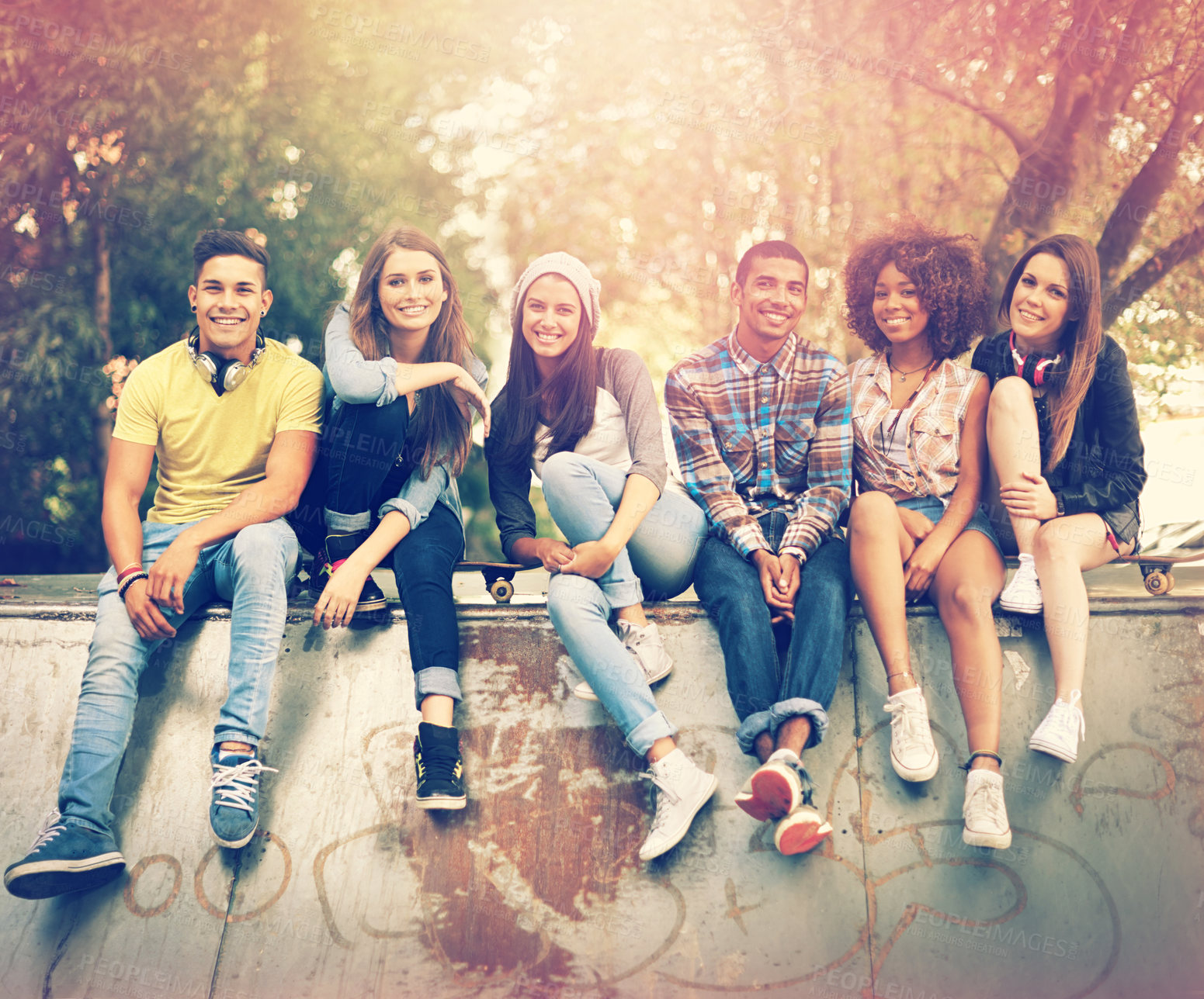 Buy stock photo Portrait of a group of friends hanging out together in an urban setting