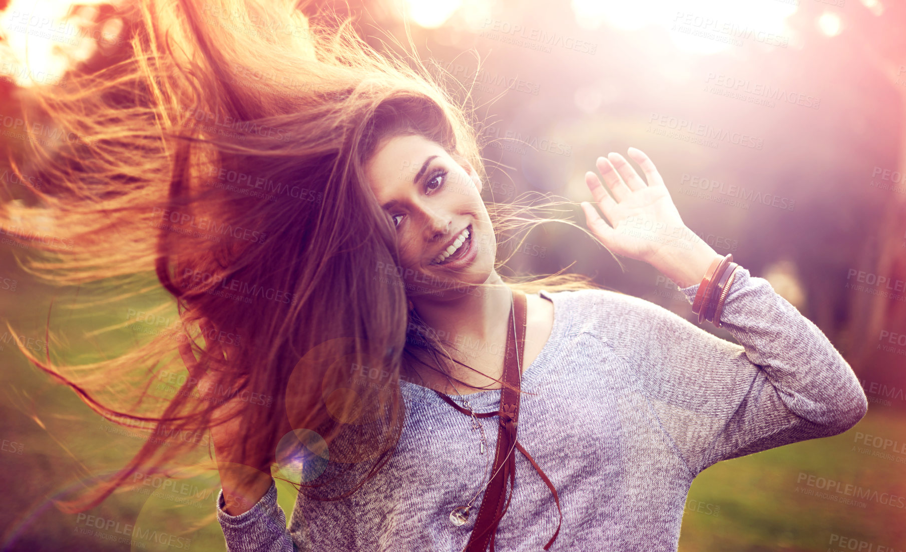 Buy stock photo Portrait, dance and hair for happy woman person, nature and freedom in outside park. Smile, confidence and dancer in summer for sunset with lens flare, joy and fun from celebration or achievement 
