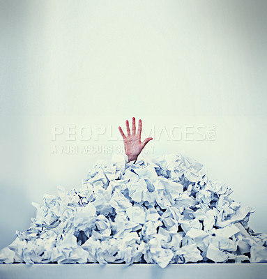Buy stock photo Cropped shot of a businessman buried under a pile of crumpled up paperwork