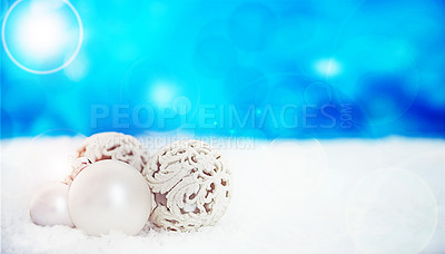Buy stock photo Ornament, studio and Christmas on snow, festive season and decoration on blue background. Decoration, object and symbol of holiday celebration on mockup space, ball and traditional bauble on backdrop