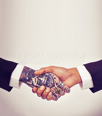 Buy stock photo Business, people and closeup handshake in studio for partnership, collaboration deal or welcome with tattoo. Team building, employees and shaking hands with mockup space or hiring on white background