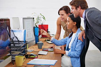 Buy stock photo Business people, teamwork and pointing to computer with coaching for meeting, creative presentation and good news. Group, employees and training in office for collaboration, project feedback or smile