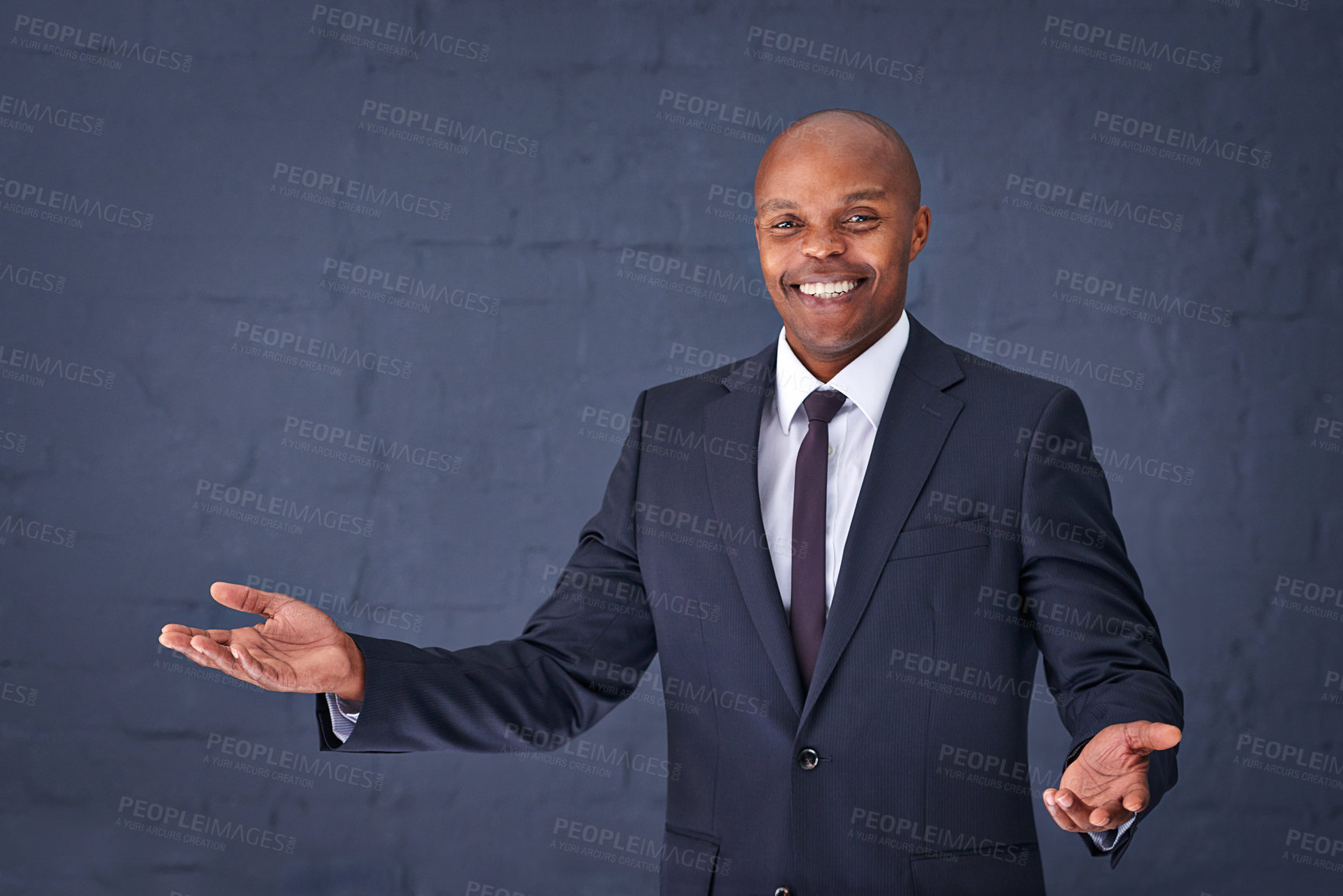 Buy stock photo Happy, portrait and black man with palm for presentation, speech or advertising on a gray studio background. African male person, businessman or speaker with smile for communication on mockup space