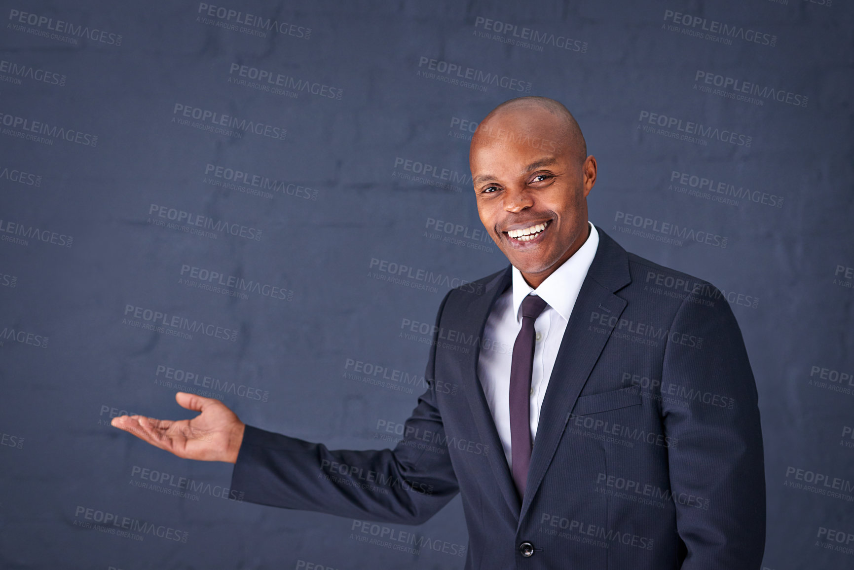 Buy stock photo Happy, portrait and black man with presentation for advertising, show or speech on a gray studio background. African male person, businessman or young speaker with smile for marketing on mockup space