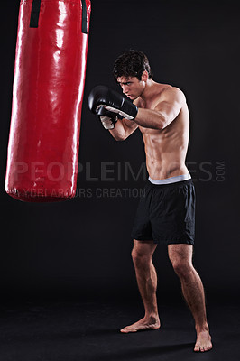 Buy stock photo Man, gloves and boxing bag for workout practice or cardio exercise for health, fighter or black background. Male person, punch and martial arts training in studio on mockup for muscle, gym or strong
