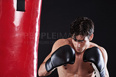 Buy stock photo Man, boxing gloves and bag for fitness practice or cardio exercise for health, fighter or black background. Male person, punch and martial arts training in studio for gym self defence, fist or mockup