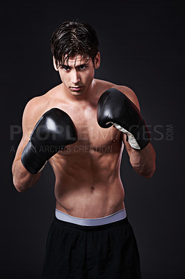 Buy stock photo Fitness, boxing and gloves on man in studio for exercise, challenge or competition training for gym. Power, muscle or serious champion boxer at workout with confidence, fight and black background