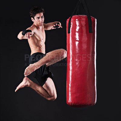 Buy stock photo Studio shot of a young mixed martial artist