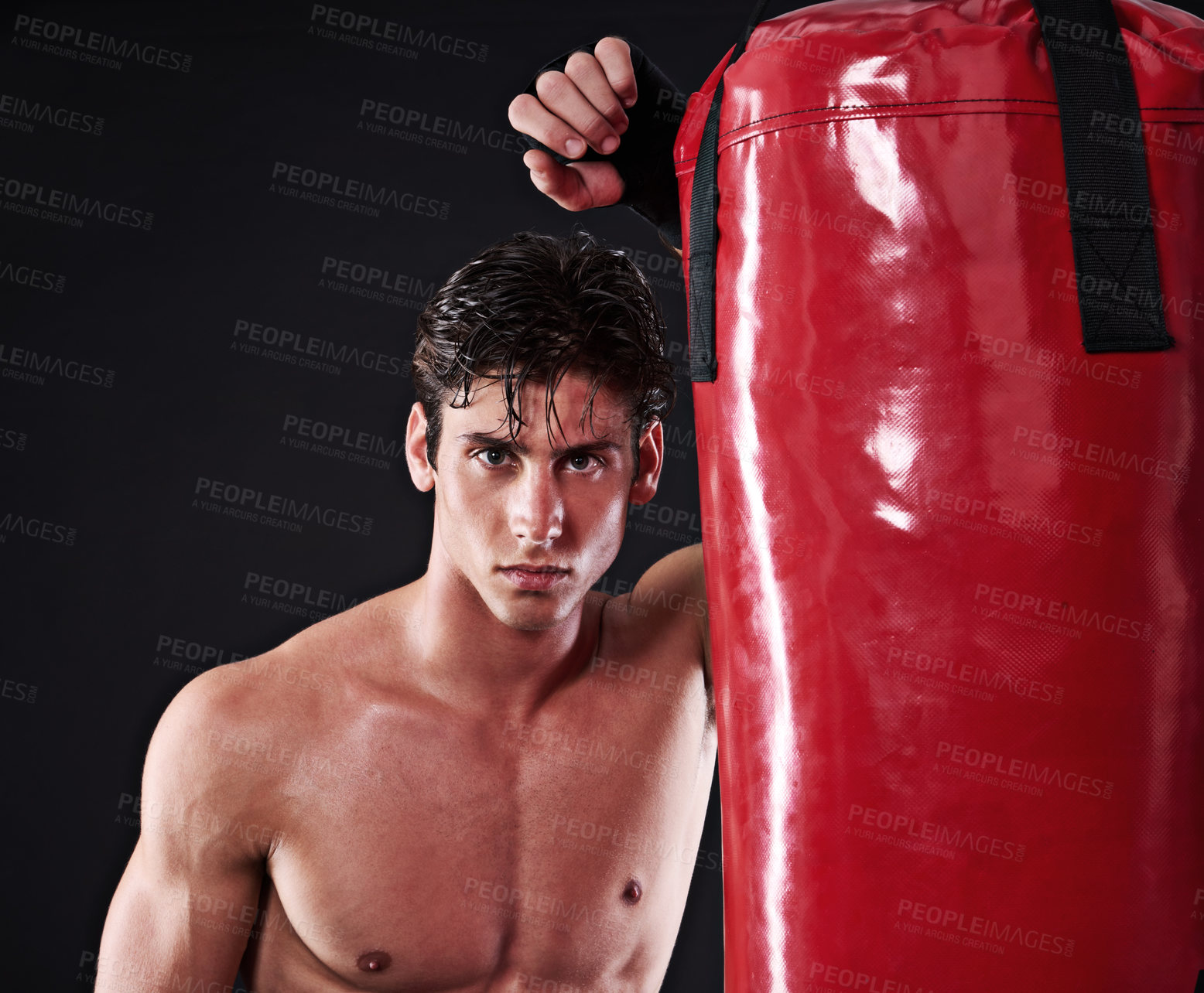 Buy stock photo Fitness, mma and portrait of man with punching bag in studio for exercise, challenge or competition training. Power, muscle or champion boxer at workout with confidence, fight and black background