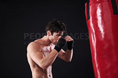 Buy stock photo Man, punching bag and workout with fitness, cardio and fighter with gloves, gym and wellness. Boxer, practice and athlete with exercise, sports and challenge with endurance, healthy guy and progress