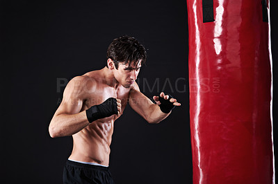 Buy stock photo Man, punching bag or workout with fitness, exercise or fighter with progress or wellness with cardio. Boxer, practice or athlete with training, balance or martial arts with endurance and healthy guy