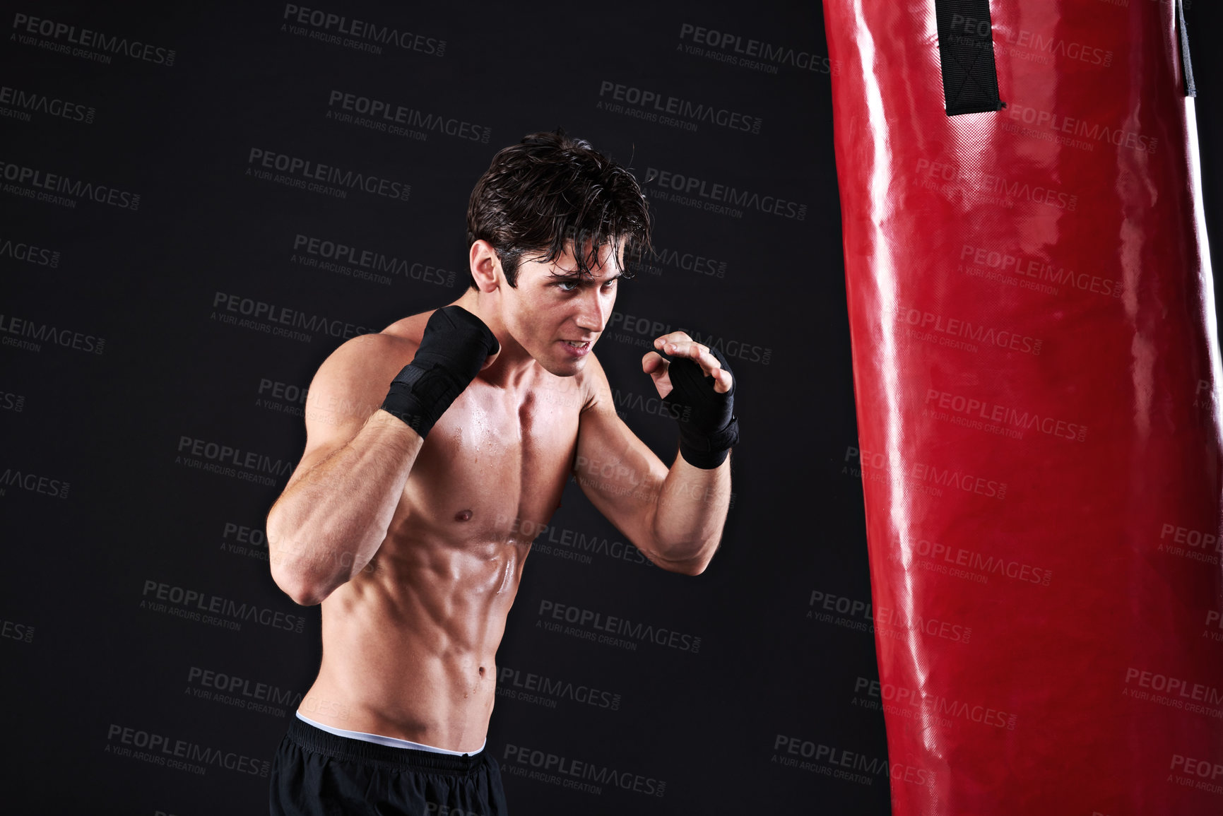 Buy stock photo Man, punching bag and martial arts with exercise, training and fighter with gloves and wellness with power. Boxer, practice and athlete with fitness and workout with endurance, healthy and progress